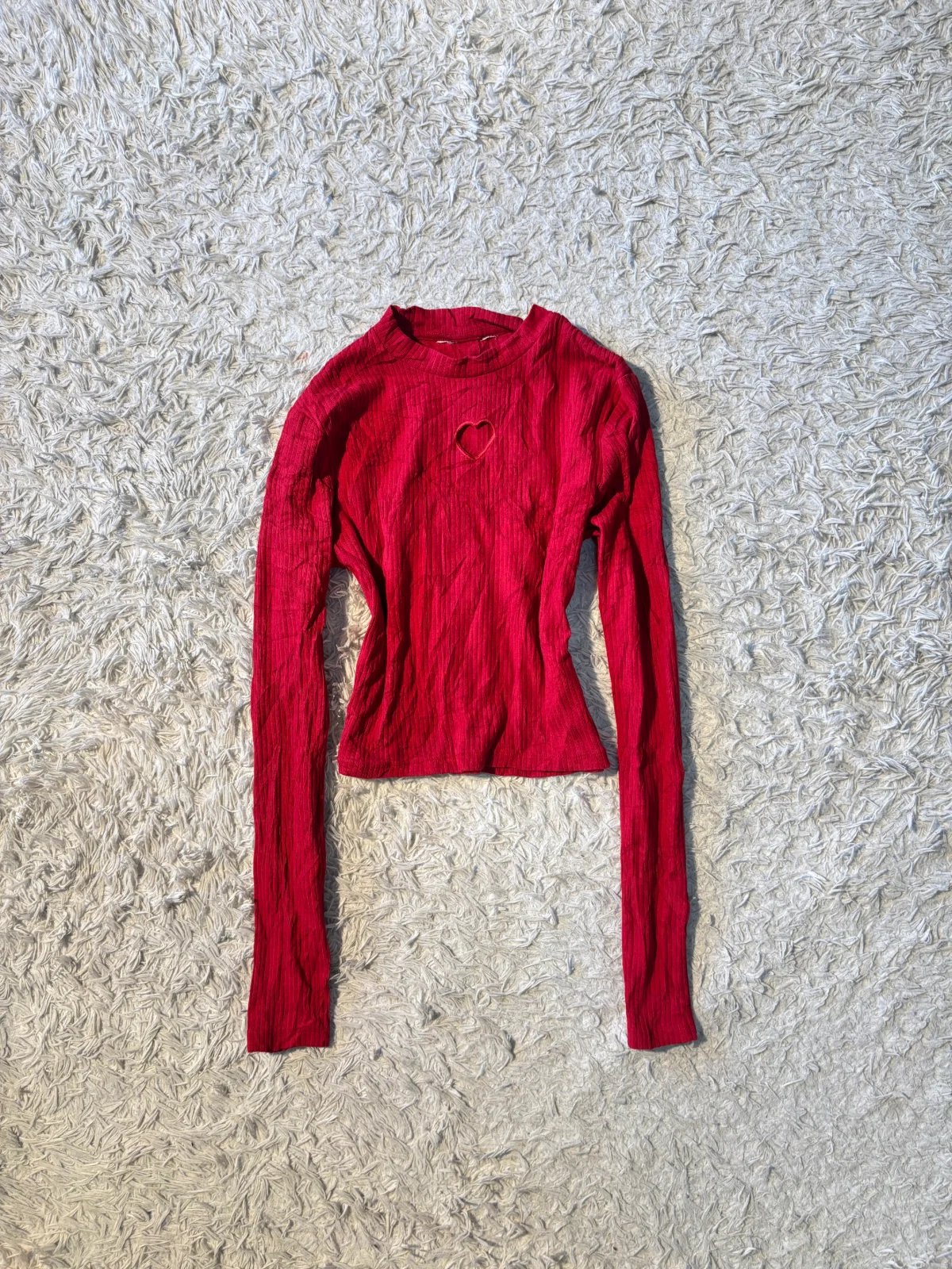 hvity red top with a heart-shaped cutout 